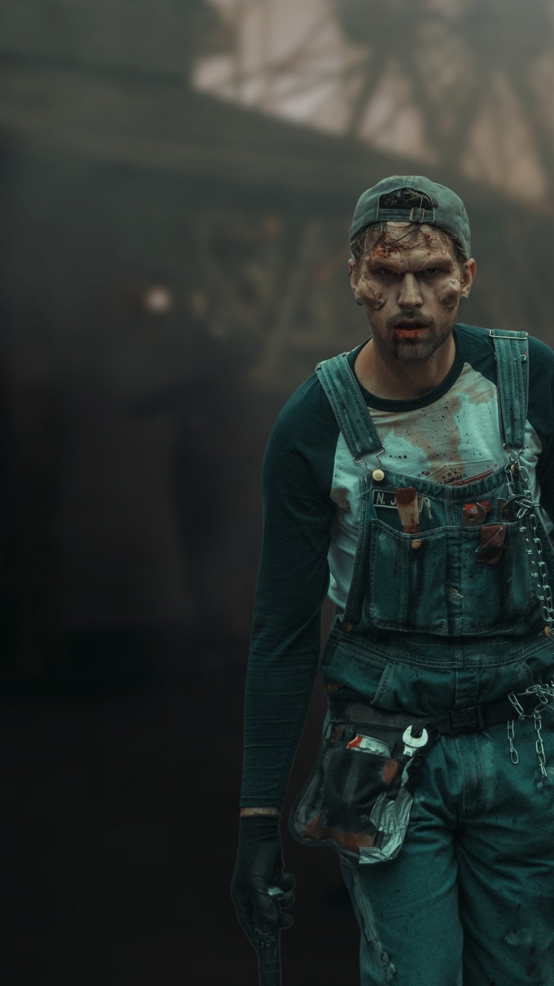 Horror clown in front of a foggy background