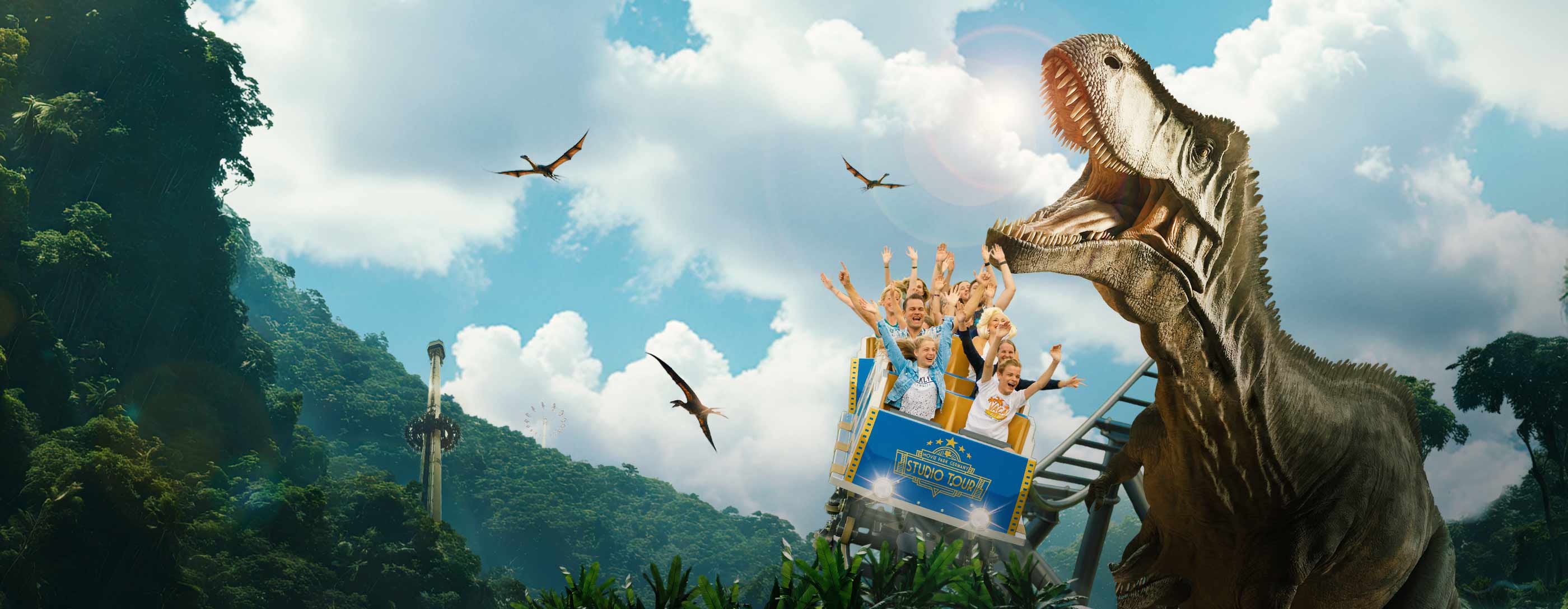 Roller coaster with T-Rex chase and flying dinosaurs in the background.